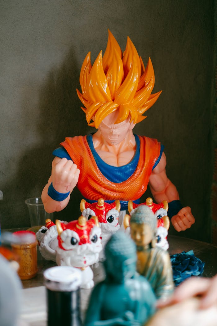A vibrant display of anime figurines including Goku amidst various collectibles against a gray background.